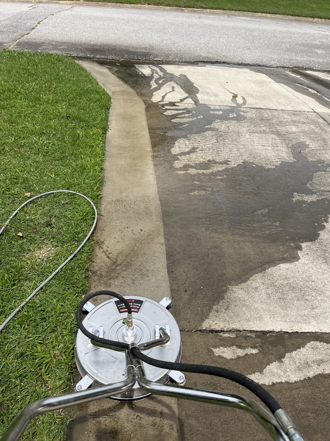 Professional driveway surface cleaner in use